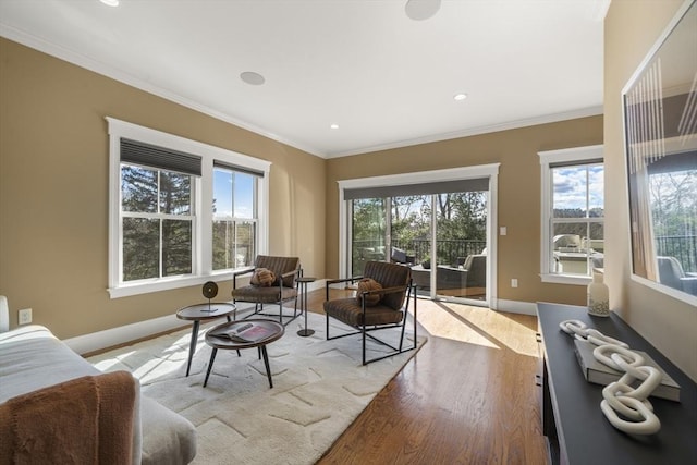 living room featuring crown molding, recessed lighting, wood finished floors, and baseboards