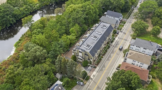 drone / aerial view featuring a residential view and a water view