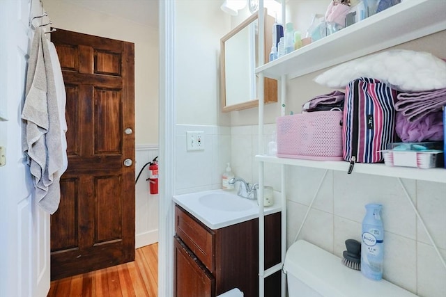 39 Chester St, Boston, MA 02134 - bathroom featuring vanity, wood finished floors, toilet, and wainscoting