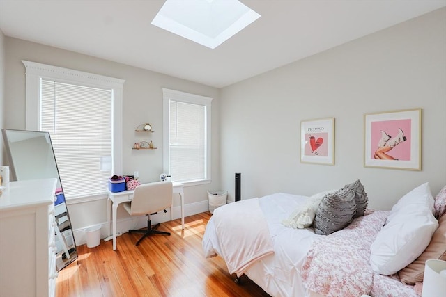 39 Chester St, Boston, MA 02134 - bedroom with wood finished floors, a skylight, and baseboards