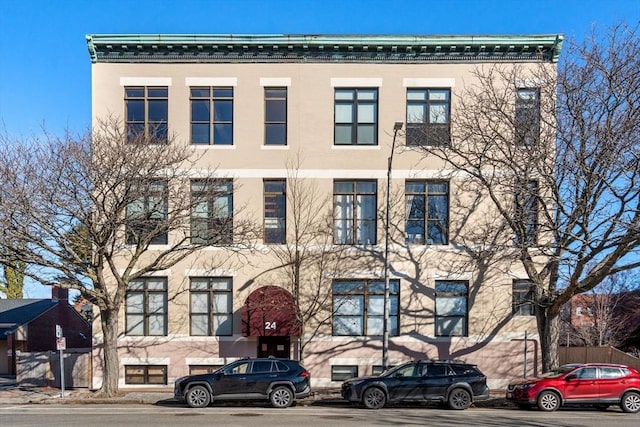 view of building exterior featuring fence