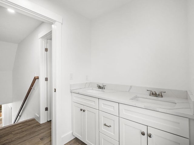 bathroom with vanity and wood-type flooring