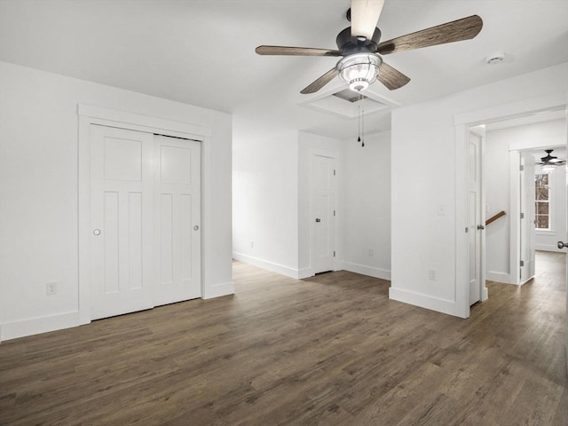 interior space with ceiling fan and dark hardwood / wood-style floors