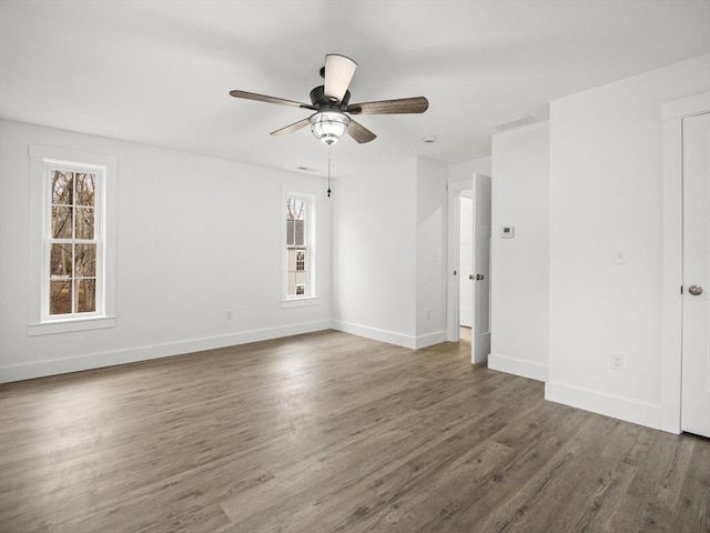 unfurnished room featuring dark hardwood / wood-style floors and ceiling fan