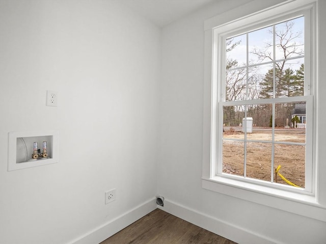 laundry room featuring electric dryer hookup, washer hookup, dark hardwood / wood-style flooring, and a healthy amount of sunlight