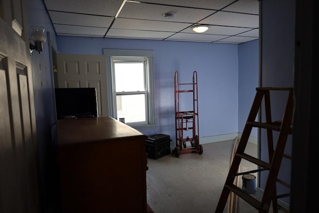 office area with a paneled ceiling