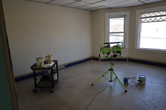 empty room featuring a drop ceiling