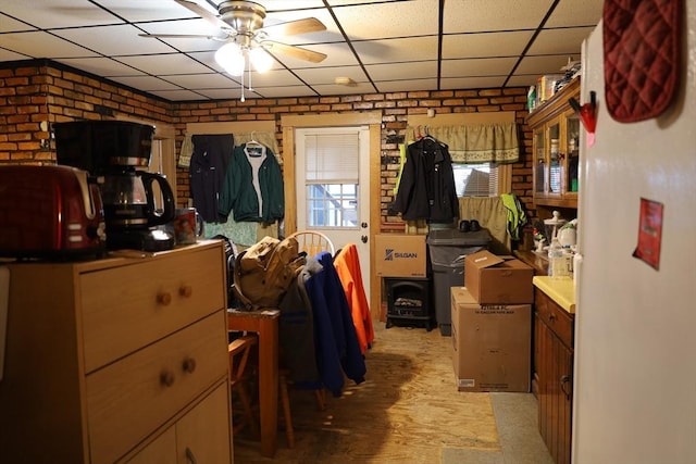 interior space with ceiling fan