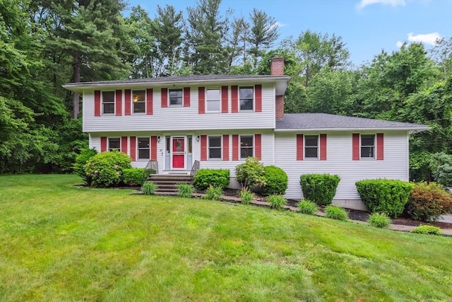 32 Berkeley, Pelham, NH 03076 - colonial home featuring a chimney and a front yard