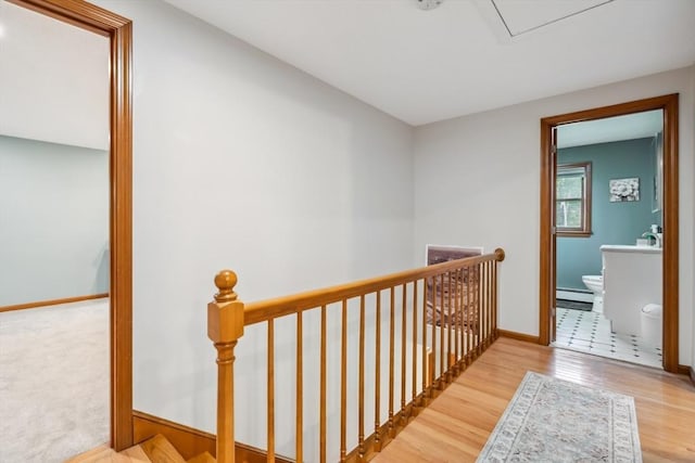 32 Berkeley, Pelham, NH 03076 - hall featuring an upstairs landing, baseboard heating, and wood finished floors