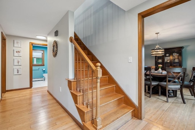 32 Berkeley, Pelham, NH 03076 - staircase featuring wood-type flooring, baseboard heating, and a chandelier