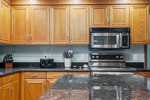32 Berkeley, Pelham, NH 03076 - kitchen with stainless steel appliances, brown cabinets, and dark stone countertops
