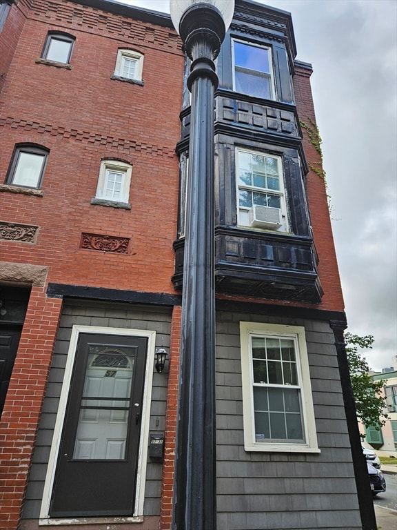 view of building exterior with cooling unit