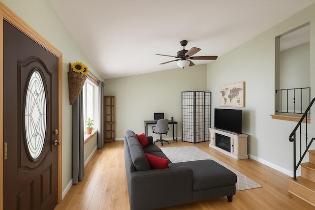 22 Sylvia Ave, Brockton, MA 02301 - living room with lofted ceiling, stairway, ceiling fan, light wood finished floors, and an office area