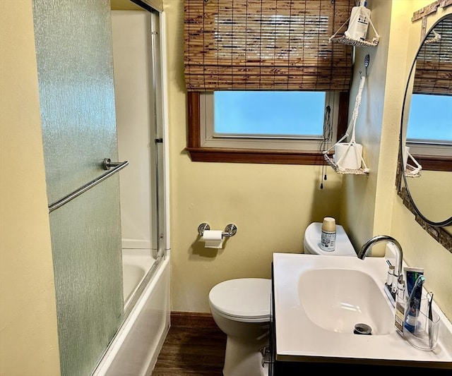 22 Sylvia Ave, Brockton, MA 02301 - bathroom featuring wood finished floors, vanity, enclosed tub / shower combo, and plenty of natural light