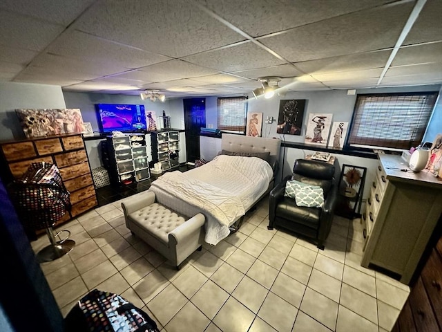 22 Sylvia Ave, Brockton, MA 02301 - bedroom with light tile patterned flooring, a paneled ceiling, a ceiling fan, and bar area
