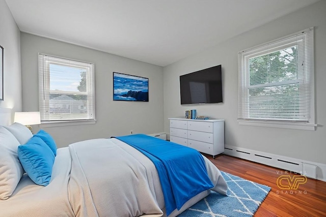 13 Meadow Ln, Acushnet, MA 02743 - bedroom with a baseboard heating unit, wood finished floors, and baseboard heating