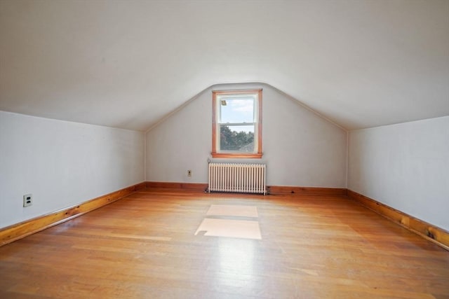 13 Meadow Ln, Acushnet, MA 02743 - additional living space featuring radiator heating unit, wood finished floors, and lofted ceiling