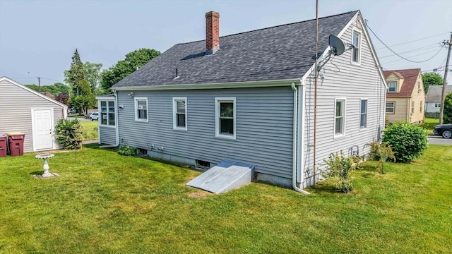 13 Meadow Ln, Acushnet, MA 02743 - rear view of property featuring a yard, a chimney, and a shingled roof