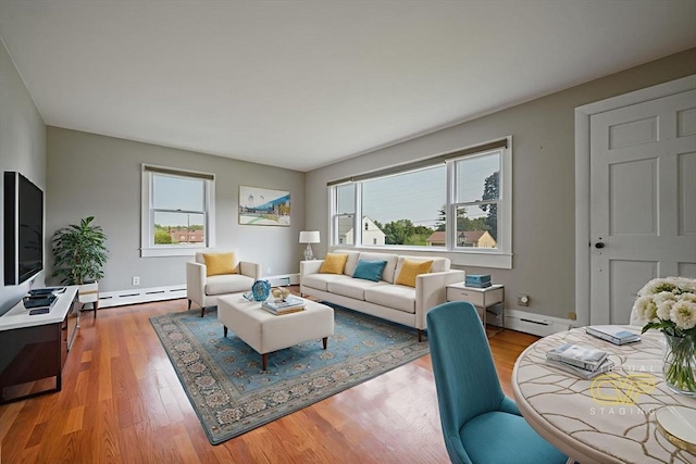 13 Meadow Ln, Acushnet, MA 02743 - living area with a baseboard heating unit, wood finished floors, and baseboard heating