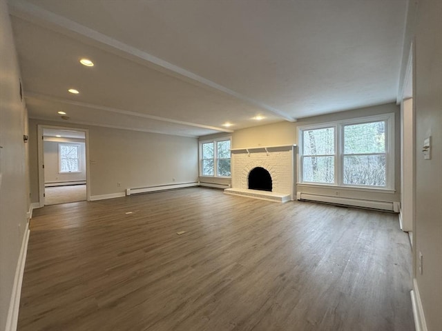 unfurnished living room featuring a brick fireplace, hardwood / wood-style flooring, and a baseboard radiator