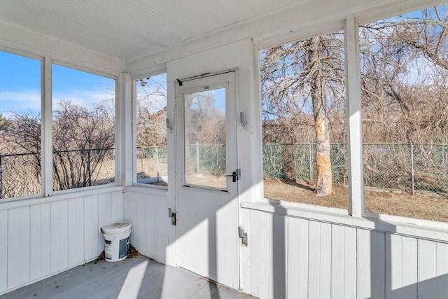 unfurnished sunroom with a wealth of natural light