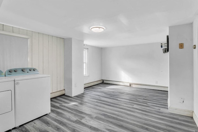 washroom featuring hardwood / wood-style floors and washing machine and dryer