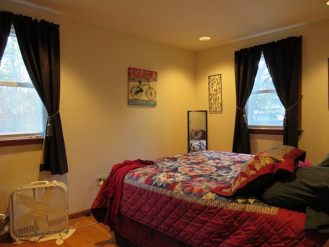 bedroom with hardwood / wood-style floors