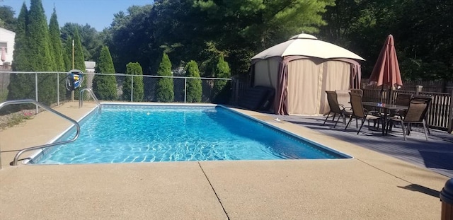 view of pool with a patio area and a gazebo