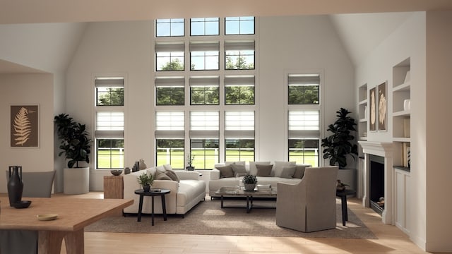 living room featuring light wood-type flooring and high vaulted ceiling