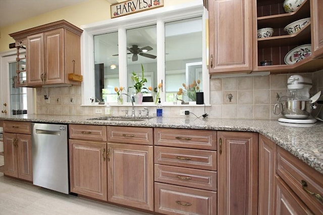 27 Summer St, Saugus, MA 01906 - kitchen with stainless steel dishwasher, a sink, light stone countertops, and backsplash