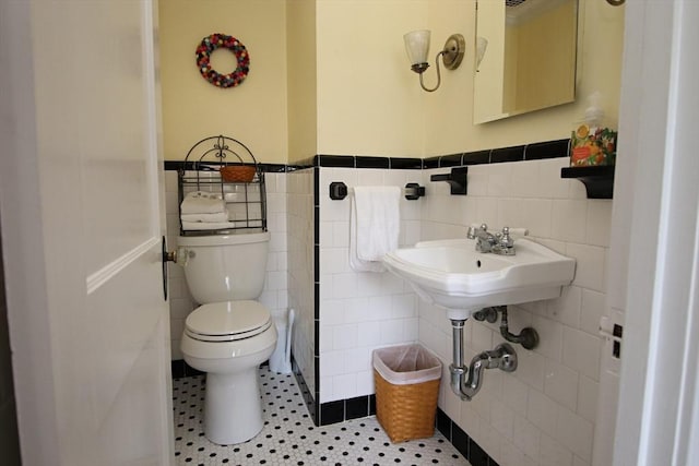 27 Summer St, Saugus, MA 01906 - bathroom featuring tile walls, toilet, and wainscoting