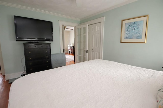 27 Summer St, Saugus, MA 01906 - bedroom featuring wood finished floors, crown molding, a closet, and baseboards