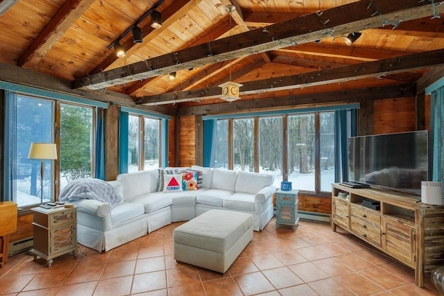 interior space with vaulted ceiling with beams, a baseboard radiator, and wood ceiling