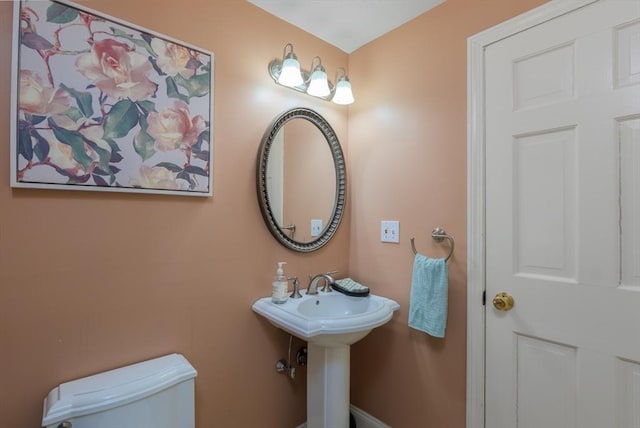 bathroom with a sink and toilet