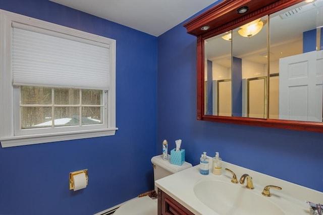 full bath featuring visible vents, vanity, a shower stall, and toilet