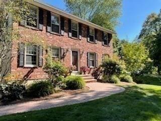 colonial house with a front lawn