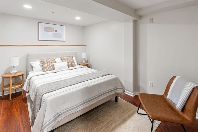 bedroom with hardwood / wood-style floors