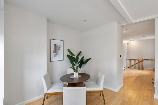 dining space featuring light hardwood / wood-style floors