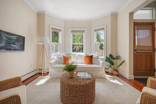 297 Cardinal Medeiros Ave Unit 1, Cambridge, MA 02141 - living area featuring a baseboard heating unit, wood finished floors, ornamental molding, and baseboards