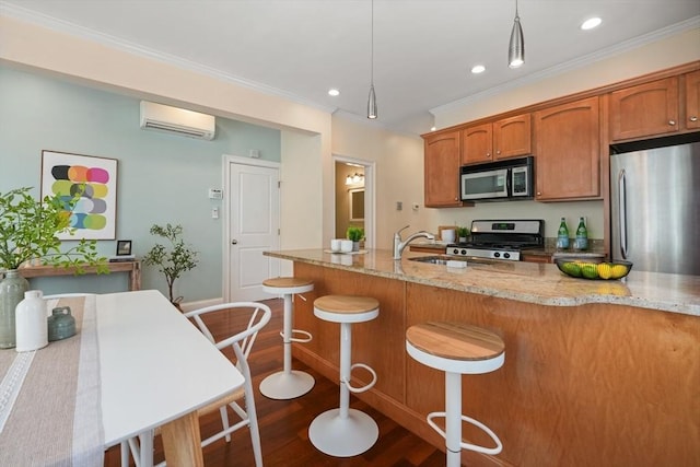 297 Cardinal Medeiros Ave Unit 1, Cambridge, MA 02141 - kitchen with appliances with stainless steel finishes, a wall mounted AC, dark wood-type flooring, ornamental molding, and recessed lighting