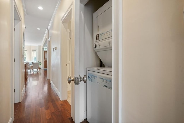 297 Cardinal Medeiros Ave Unit 1, Cambridge, MA 02141 - hallway featuring estacked washer and dryer, dark wood finished floors, crown molding, recessed lighting, and baseboards