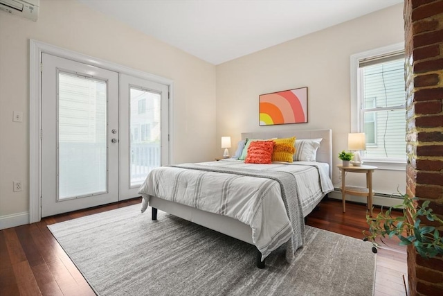 297 Cardinal Medeiros Ave Unit 1, Cambridge, MA 02141 - bedroom featuring french doors, access to exterior, wood-type flooring, and baseboard heating