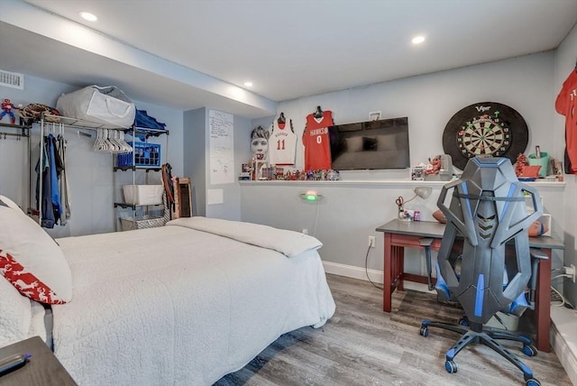 bedroom featuring hardwood / wood-style flooring