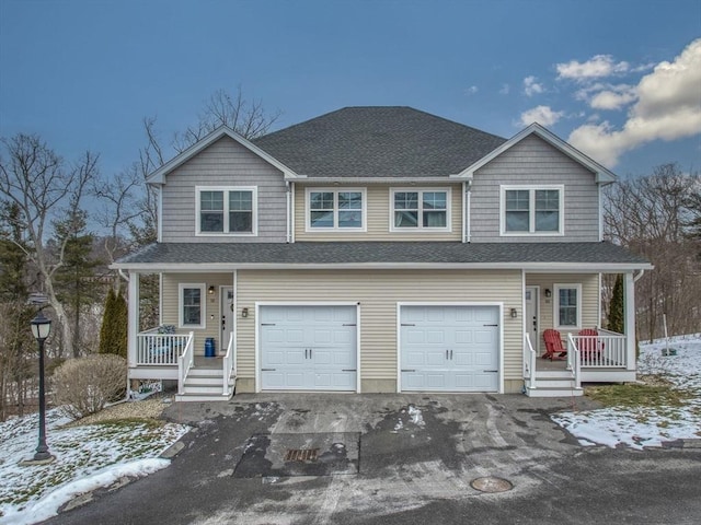 view of front of home with covered porch and a garage