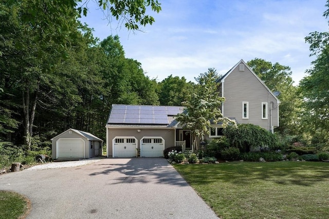 61 Northbridge Rd, Mendon, MA 01756 - view of front facade with solar panels, a front lawn, and an outbuilding