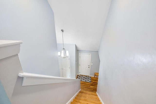 61 Northbridge Rd, Mendon, MA 01756 - stairway with wood finished floors, a chandelier, baseboards, and vaulted ceiling