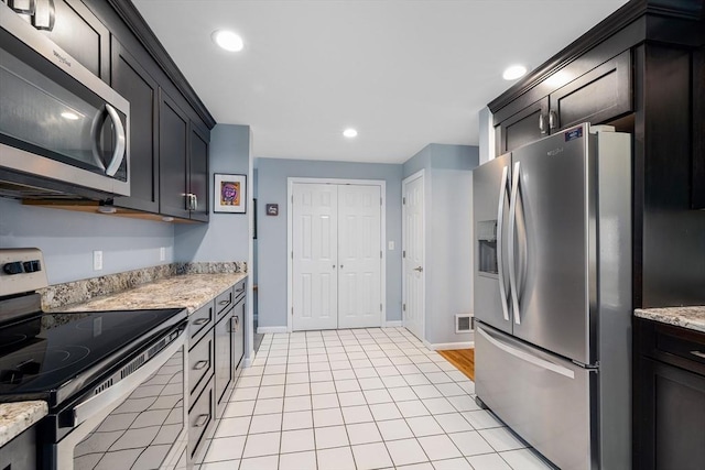 61 Northbridge Rd, Mendon, MA 01756 - kitchen with stainless steel appliances, baseboards, recessed lighting, light stone countertops, and light tile patterned floors