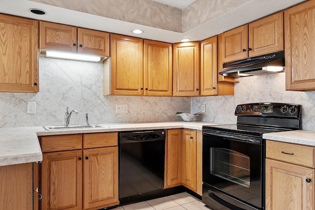5 Thomas St Unit P17, Saugus, MA 01906 - kitchen featuring black appliances, under cabinet range hood, light countertops, tasteful backsplash, and light tile patterned floors