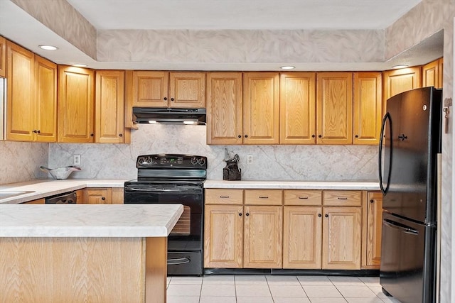 5 Thomas St Unit P17, Saugus, MA 01906 - kitchen with black appliances, under cabinet range hood, light countertops, light tile patterned flooring, and tasteful backsplash